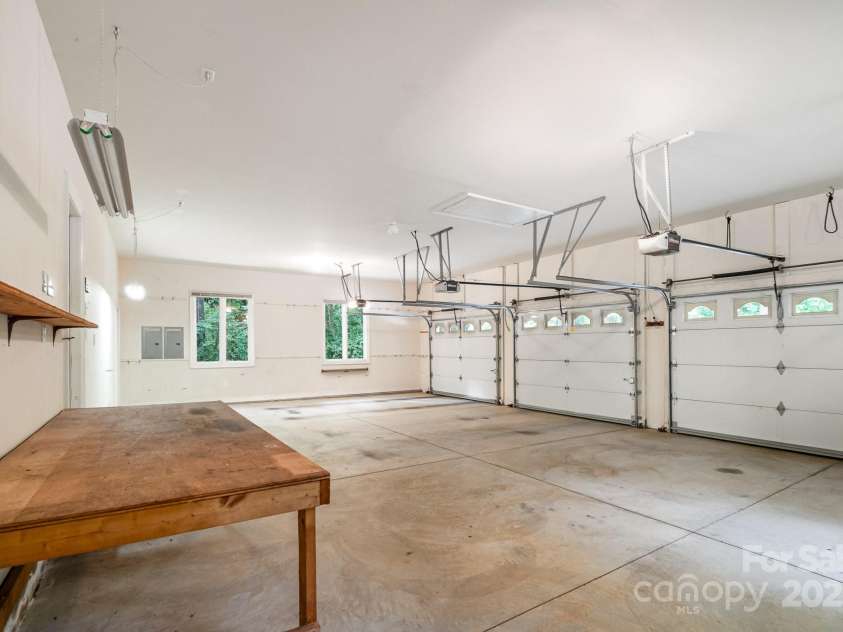 6868 St Peters Lane, Matthews, NC 28105.  MLS# CAR4251557, YatesRealty ID 12768. 3-car garage workshop