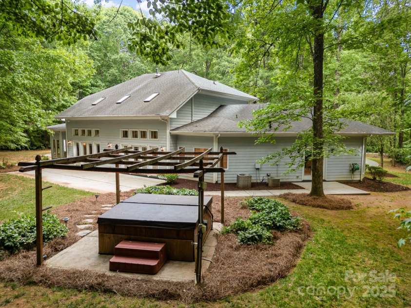 6868 St Peters Lane, Matthews, NC 28105.  MLS# CAR4251557, YatesRealty ID 12768. Back yard oasis with hot tub.
