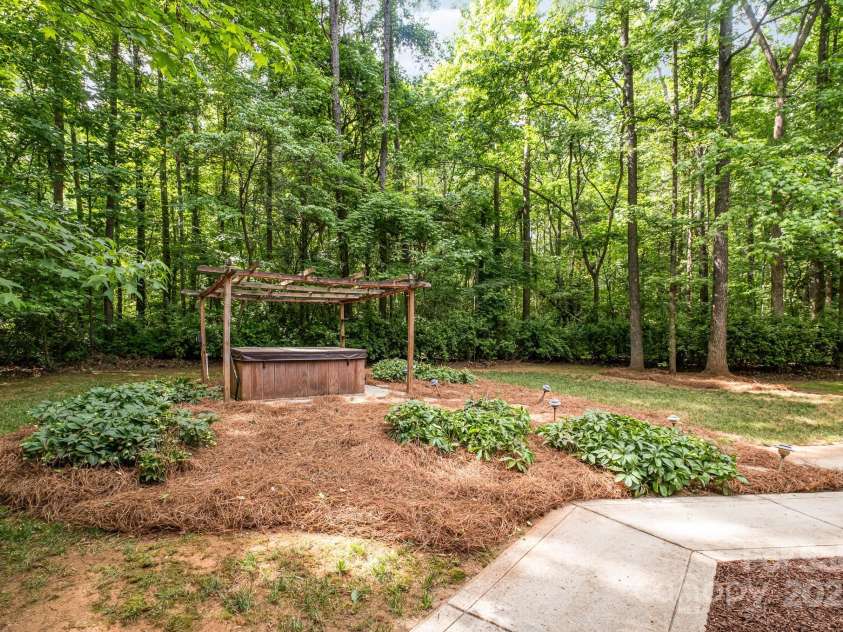 6868 St Peters Lane, Matthews, NC 28105.  MLS# CAR4251557, YatesRealty ID 12768. Back yard oasis with hot tub