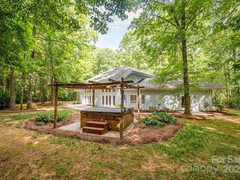 6868 St Peters Lane, Matthews, NC 28105.  MLS# CAR4251557, YatesRealty ID 12768. Back yard oasis with hot tub