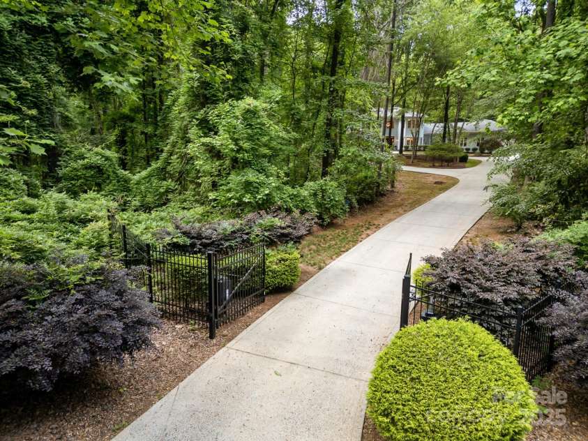 6868 St Peters Lane, Matthews, NC 28105.  MLS# CAR4251557, YatesRealty ID 12768. Gated circular driveway
