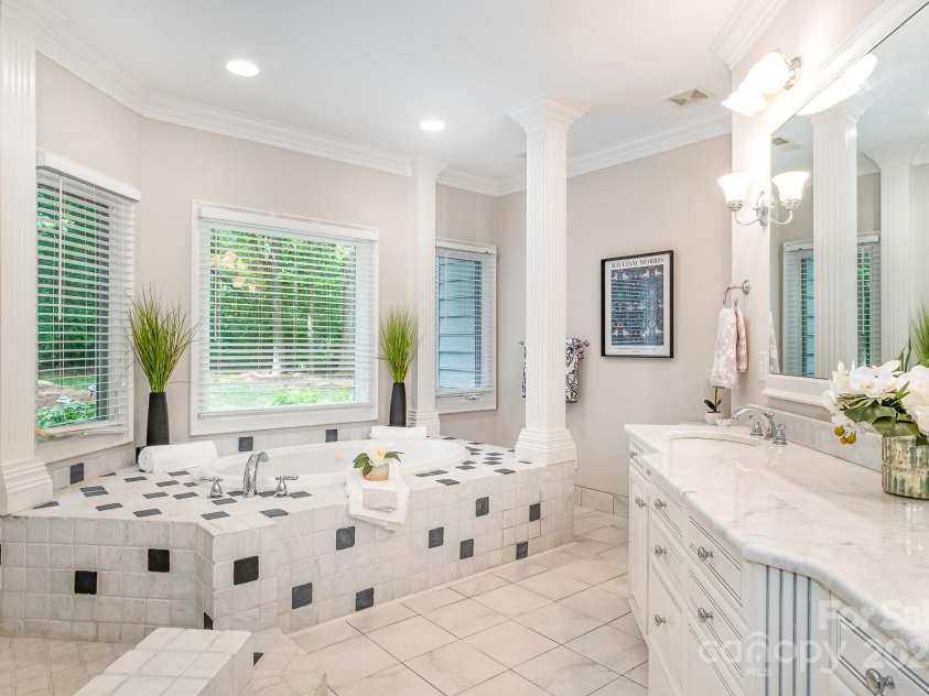 6868 St Peters Lane, Matthews, NC 28105.  MLS# CAR4251557, YatesRealty ID 12768. Spa Inspired primary bathroom