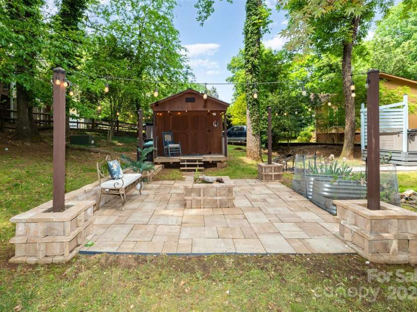 3004 Point Clear Drive, Tega Cay, SC 29708.  MLS# CAR4249209, YatesRealty ID 12772. Patio with fire pit and shed