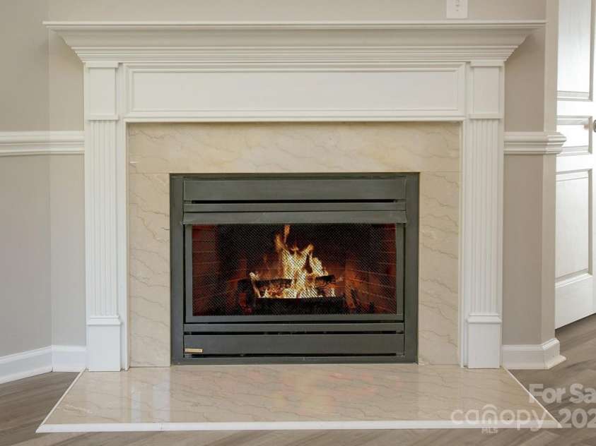 4938 Sunset Ridge Court, Charlotte, NC 28269.  MLS# CAR4256008, YatesRealty ID 12774. And movie nights in the winter will be even cozier thanks to your gas fireplace.