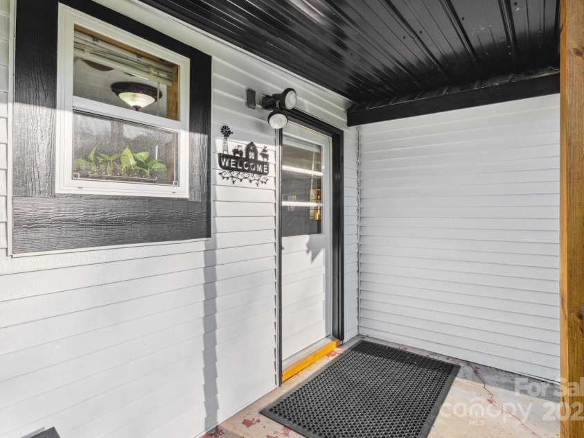 15 Curly Willow Lane, Weaverville, NC 28787.  MLS# CAR4246546, YatesRealty ID 12781. Covered back door going into kitchen