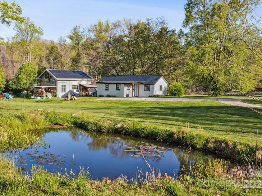 15 Curly Willow Lane, Weaverville, NC 28787.  MLS# CAR4246546, YatesRealty ID 12781. Koi pond at back of property