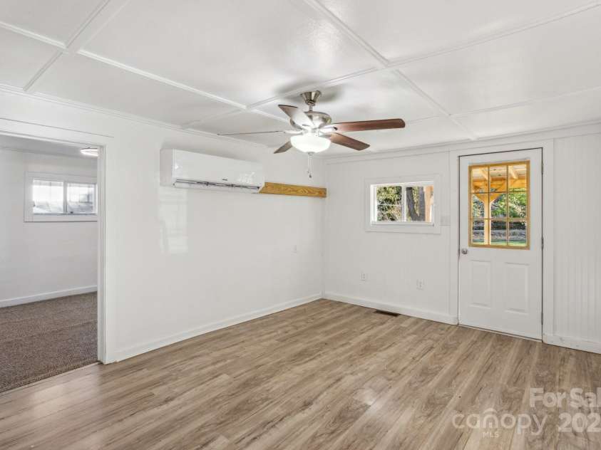 15 Curly Willow Lane, Weaverville, NC 28787.  MLS# CAR4246546, YatesRealty ID 12781. Living room looking into 2nd bedroom
