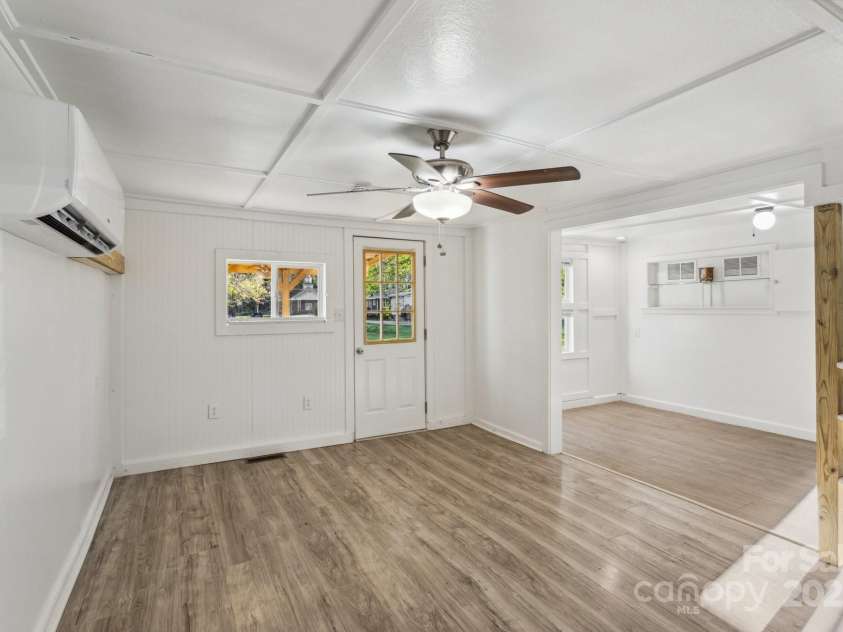 15 Curly Willow Lane, Weaverville, NC 28787.  MLS# CAR4246546, YatesRealty ID 12781. Living room looking towards front door and dining area