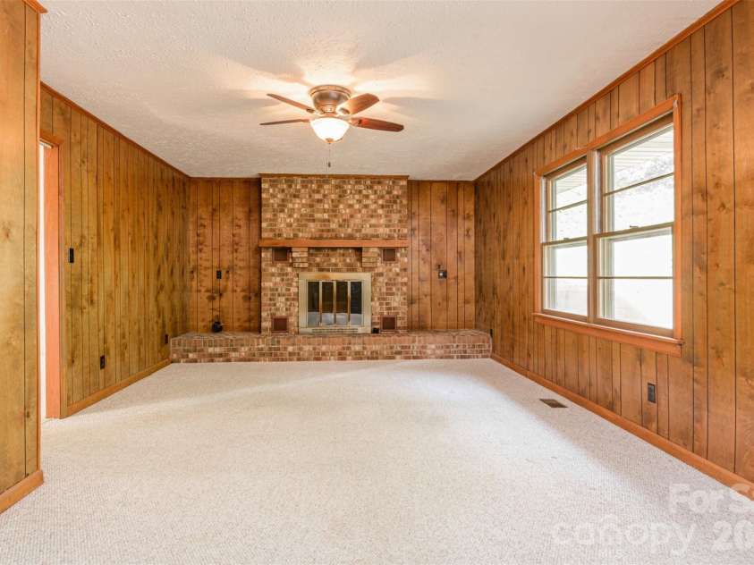 261 Cedar Lane, Arden, NC 28704.  MLS# CAR4366543, YatesRealty ID 12781. Den with Gas Fireplace