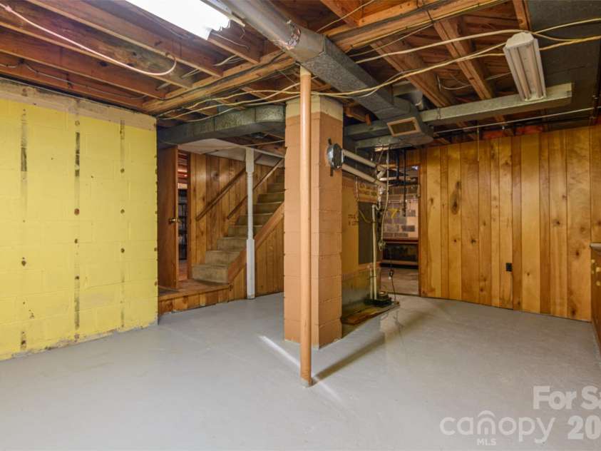 261 Cedar Lane, Arden, NC 28704.  MLS# CAR4366543, YatesRealty ID 12781. Large Basement with tons of opportunity