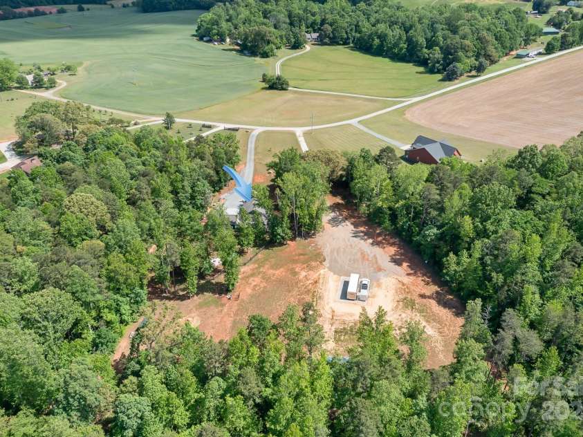 720 Cricket Lane, Mt Ulla, NC 28125.  MLS# CAR4254879, YatesRealty ID 12785. Aerial towards road