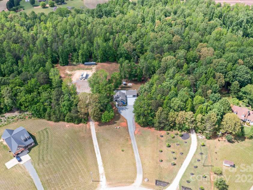 720 Cricket Lane, Mt Ulla, NC 28125.  MLS# CAR4254879, YatesRealty ID 12785. Aerial view, looking back over 10 acres