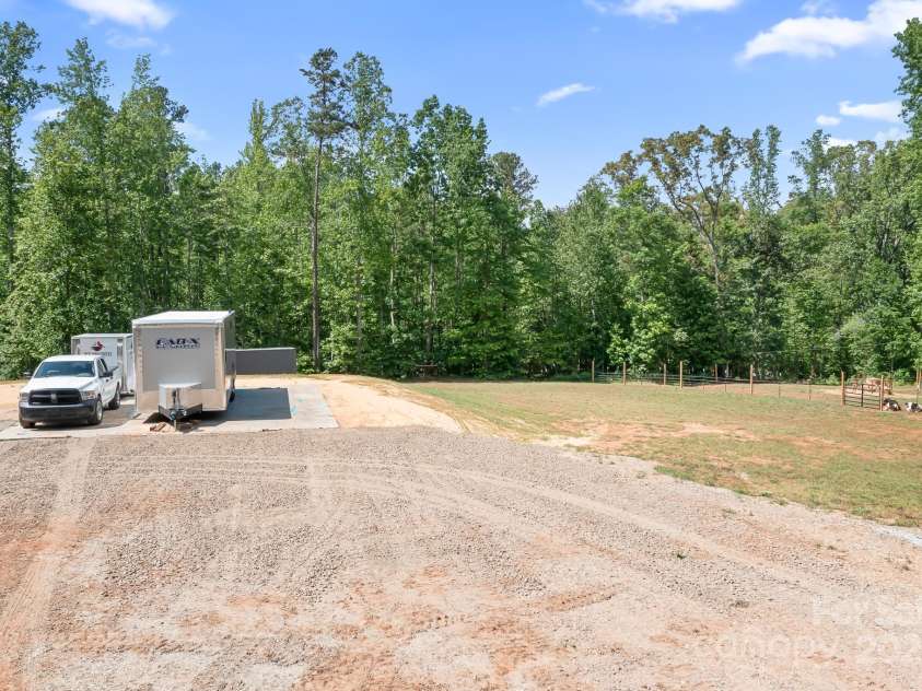 720 Cricket Lane, Mt Ulla, NC 28125.  MLS# CAR4254879, YatesRealty ID 12785. Giant concrete pad with another private driveway