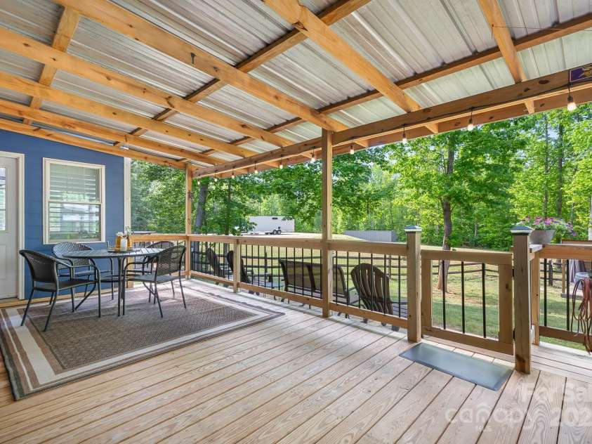 720 Cricket Lane, Mt Ulla, NC 28125.  MLS# CAR4254879, YatesRealty ID 12785. Massive deck, with bar