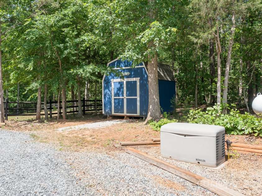 720 Cricket Lane, Mt Ulla, NC 28125.  MLS# CAR4254879, YatesRealty ID 12785. Outdoor shed AND Kohler Generator