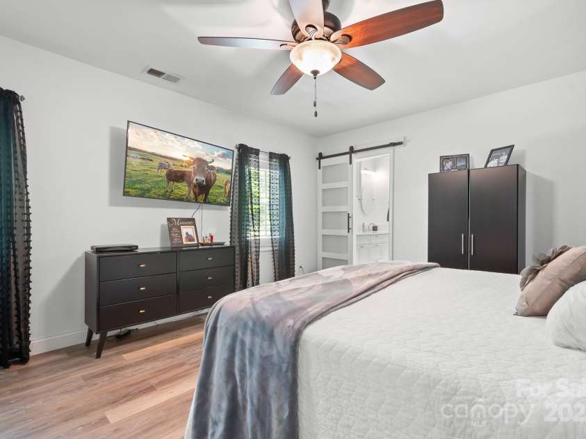 720 Cricket Lane, Mt Ulla, NC 28125.  MLS# CAR4254879, YatesRealty ID 12785. Primary with barn door to bath