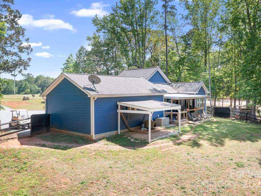 720 Cricket Lane, Mt Ulla, NC 28125.  MLS# CAR4254879, YatesRealty ID 12785. Rear view with storage lean-to