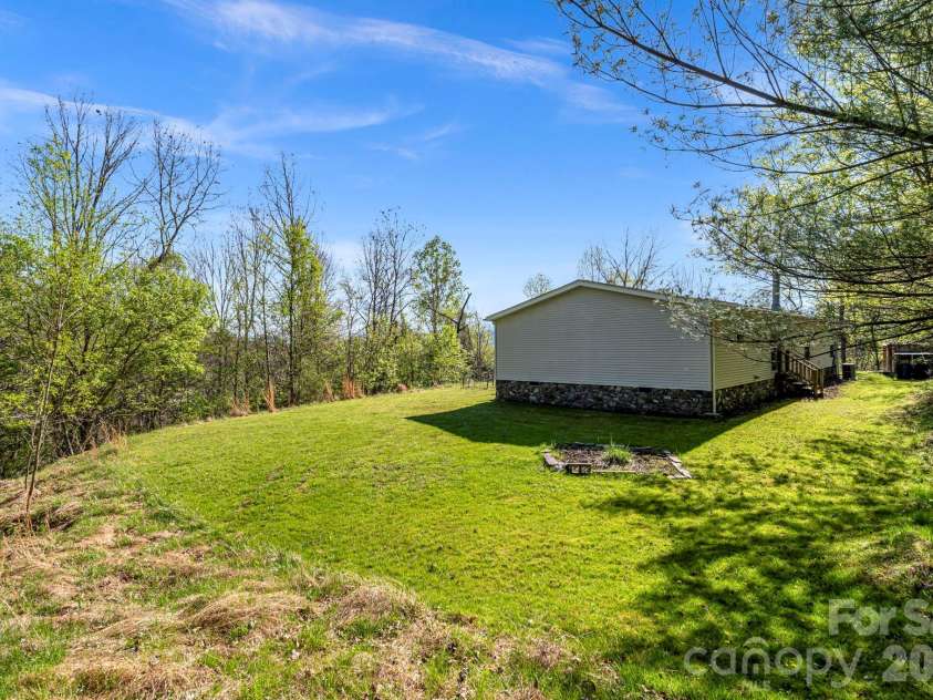 36 Tyler Cove, Alexander, NC 28701.  MLS# CAR4343099, YatesRealty ID 12786. Exterior - Side Yard