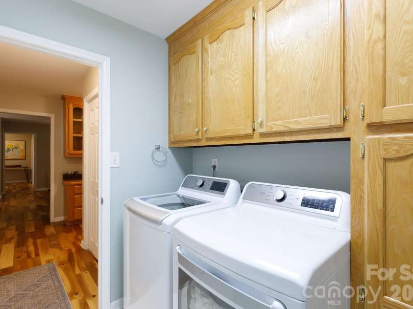 228 Timberlane Drive, Belmont, NC 28012.  MLS# CAR4369910, YatesRealty ID 12788. Cabinet and storage in laundry