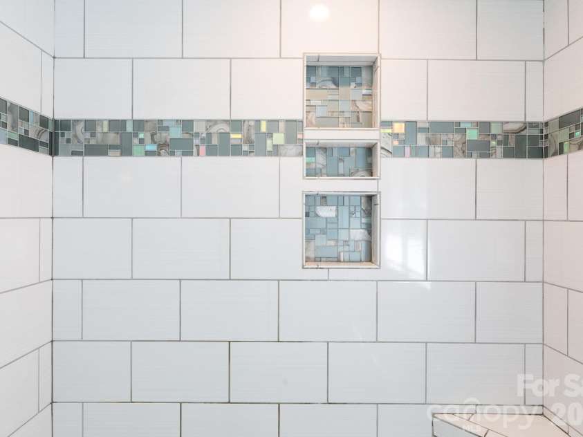 228 Timberlane Drive, Belmont, NC 28012.  MLS# CAR4369910, YatesRealty ID 12788. Custom tile surround in shower