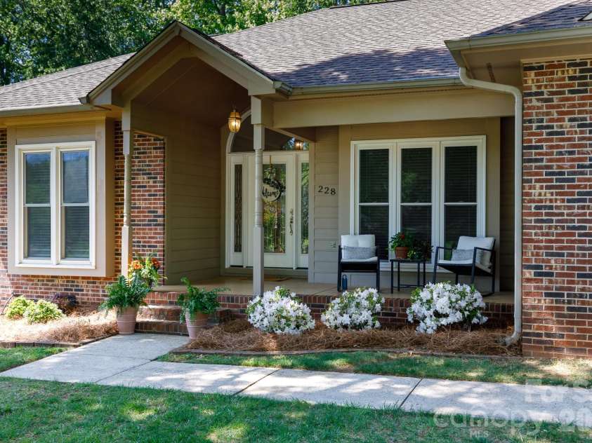 228 Timberlane Drive, Belmont, NC 28012.  MLS# CAR4369910, YatesRealty ID 12788. Paved walkway