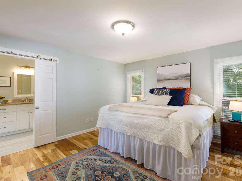 228 Timberlane Drive, Belmont, NC 28012.  MLS# CAR4369910, YatesRealty ID 12788. Primary ensuite w/ barn doors to bath