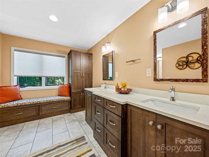 150 Sondley Parkway, Asheville, NC 28805.  MLS# CAR4280880, YatesRealty ID 1279. Double vanities with a window seat in primary bath