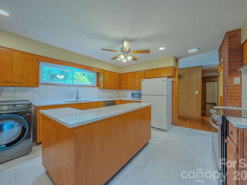 105 Alexander Avenue, Swannanoa, NC 28778.  MLS# CAR4289989, YatesRealty ID 12790. Laundry in kitchen