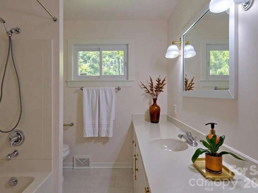 105 Alexander Avenue, Swannanoa, NC 28778.  MLS# CAR4289989, YatesRealty ID 12790. Virtually staged bathroom