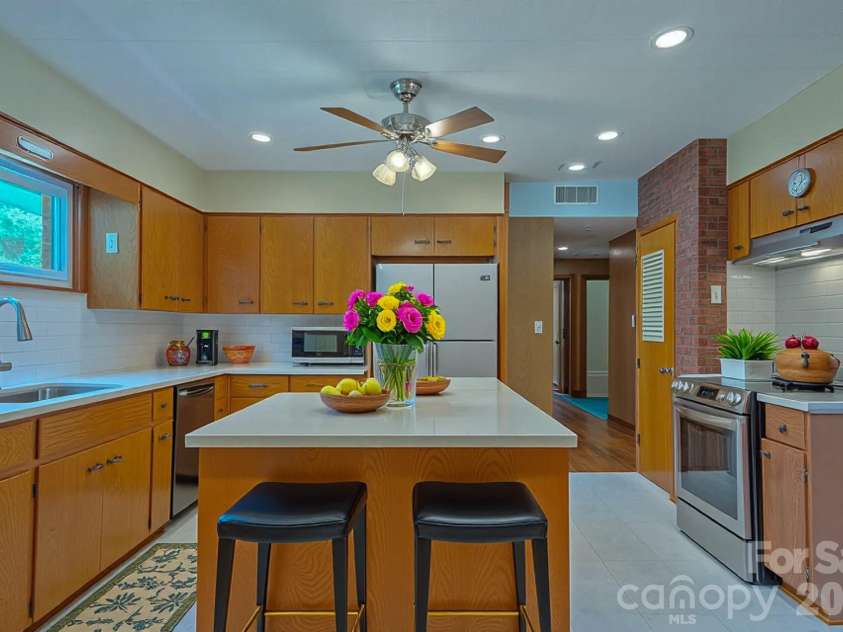 105 Alexander Avenue, Swannanoa, NC 28778.  MLS# CAR4289989, YatesRealty ID 12790. Virtually staged kitchen