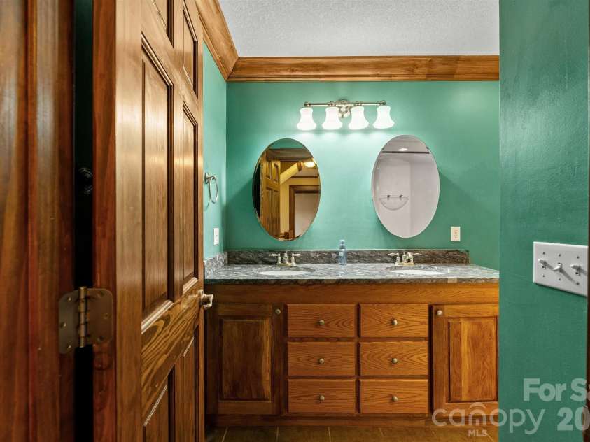 22 Pear Tree Lane, Leicester, NC 28748.  MLS# CAR4371027, YatesRealty ID 12806. 2nd level hall bath with custom, handcrafted double vanity