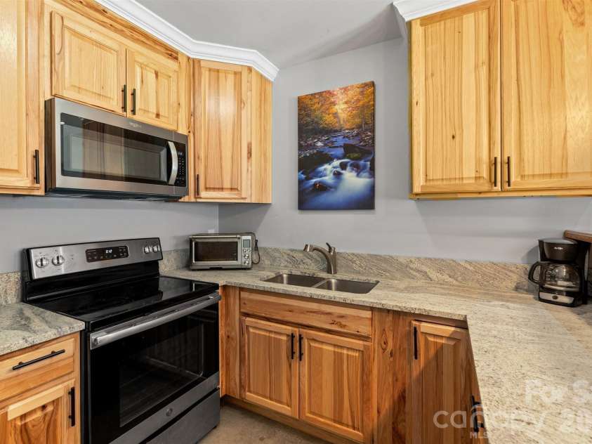 22 Pear Tree Lane, Leicester, NC 28748.  MLS# CAR4371027, YatesRealty ID 12806. Full size electric range and a 2nd microwave