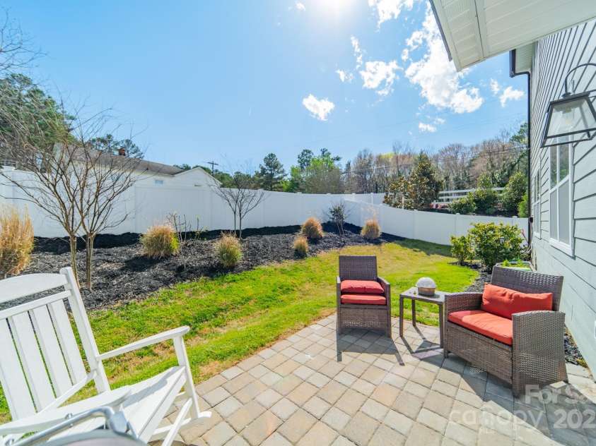 5006 Whitman Avenue, Matthews, NC 28105.  MLS# CAR4237851, YatesRealty ID 12807. Back patio