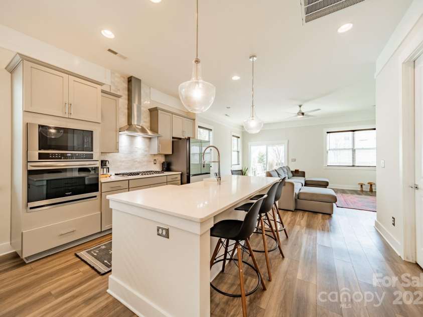 5006 Whitman Avenue, Matthews, NC 28105.  MLS# CAR4237851, YatesRealty ID 12807. Kitchen with large quartz island