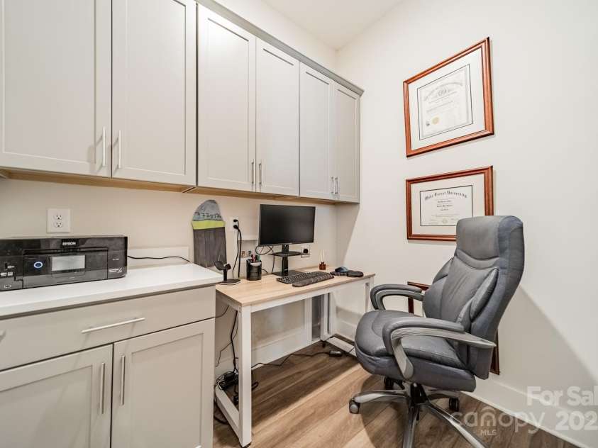 5006 Whitman Avenue, Matthews, NC 28105.  MLS# CAR4237851, YatesRealty ID 12807. Main level laundry room being used as an office