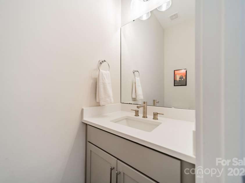 5006 Whitman Avenue, Matthews, NC 28105.  MLS# CAR4237851, YatesRealty ID 12807. Main level powder room