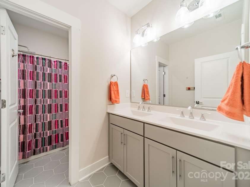 5006 Whitman Avenue, Matthews, NC 28105.  MLS# CAR4237851, YatesRealty ID 12807. Upper level bath 1