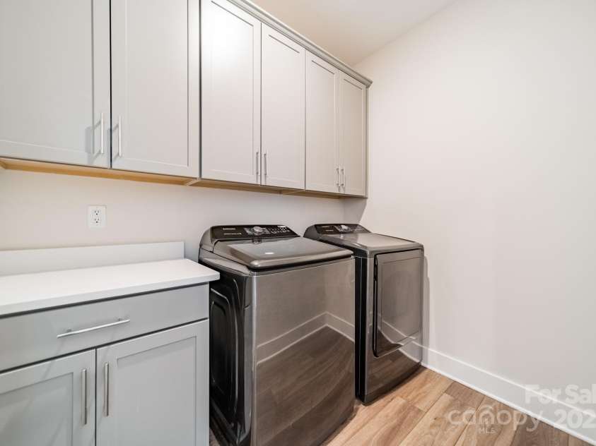 5006 Whitman Avenue, Matthews, NC 28105.  MLS# CAR4237851, YatesRealty ID 12807. Upper level laundry room