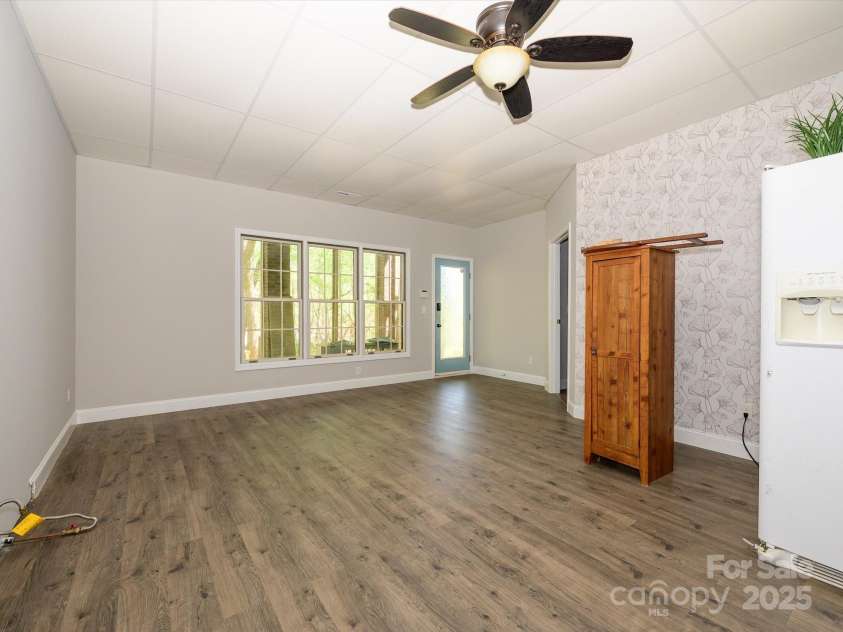 1448-1 New Prospect Church Road, Shelby, NC 28150.  MLS# CAR4214412, YatesRealty ID 12811. Basement area Family Room is spacious. It has door to the rear covered patio area.