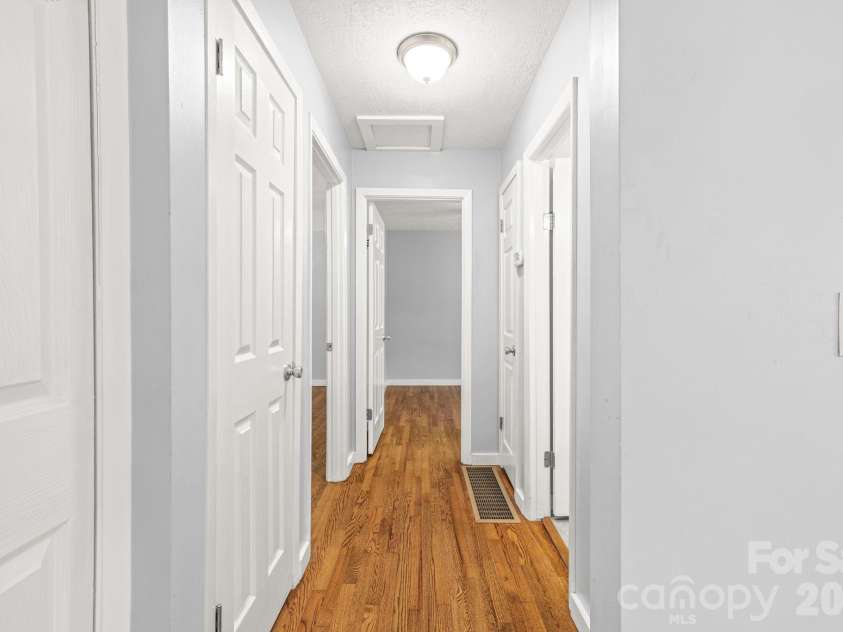 154 Cactus Lane, Franklin, NC 28734.  MLS# CAR4353446, YatesRealty ID 12812. Hallway to Bedroom 2 and 3