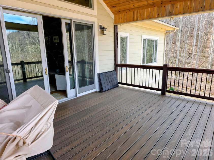 254 Ray Mine Road, Burnsville, NC 28714.  MLS# CAR4351718, YatesRealty ID 12813. Covered front deck/porch with Trex decking
