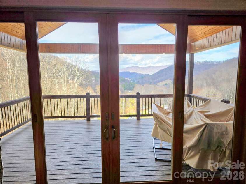 254 Ray Mine Road, Burnsville, NC 28714.  MLS# CAR4351718, YatesRealty ID 12813. Looking at front porch/deck from great room