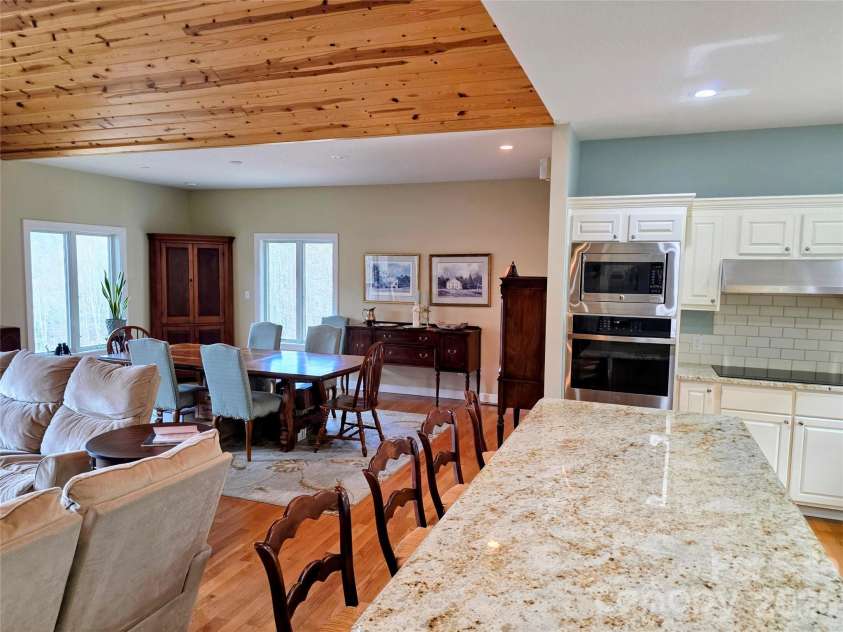 254 Ray Mine Road, Burnsville, NC 28714.  MLS# CAR4351718, YatesRealty ID 12813. Open floorplan with island, dining area and ovens