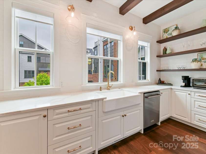 3064 Selwyn Avenue, Charlotte, NC 28209.  MLS# CAR4247196, YatesRealty ID 12817. Farmhouse sink, loads of natural light and open shelving