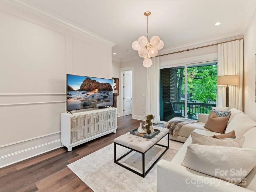 3064 Selwyn Avenue, Charlotte, NC 28209.  MLS# CAR4247196, YatesRealty ID 12817. Sliding glass door leading to covered balcony