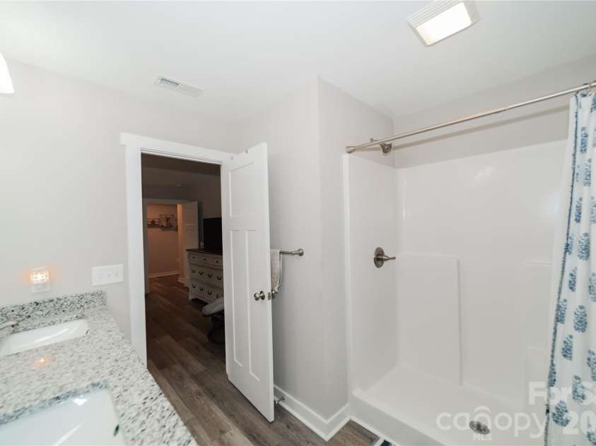 1338 Eastside Avenue, Albemarle, NC 28001.  MLS# CAR4342335, YatesRealty ID 1282. A private primary bath featuring updated finishes and a clean, modern feel.