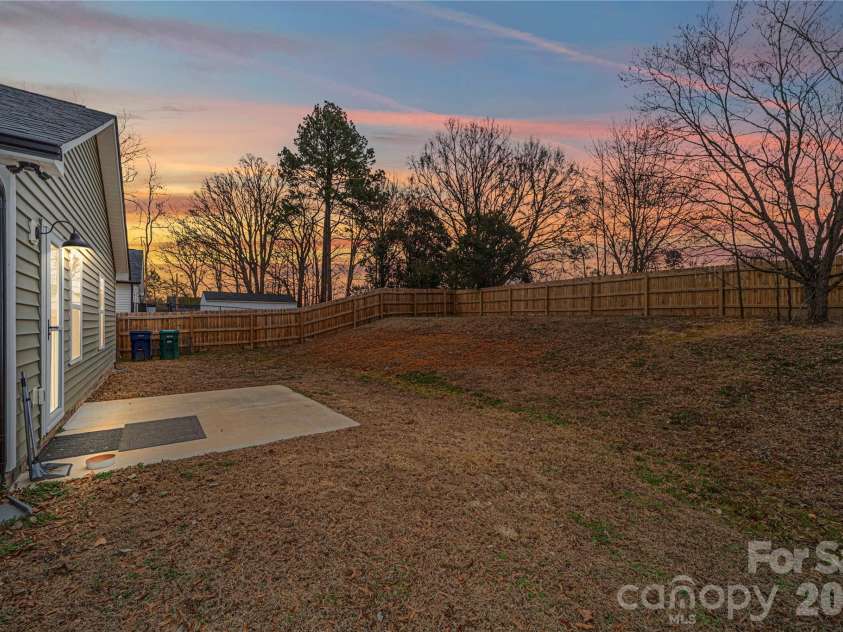 1338 Eastside Avenue, Albemarle, NC 28001.  MLS# CAR4342335, YatesRealty ID 1282. The fully fenced backyard creates a private retreat, perfect for pets, play, or outdoor entertaining.