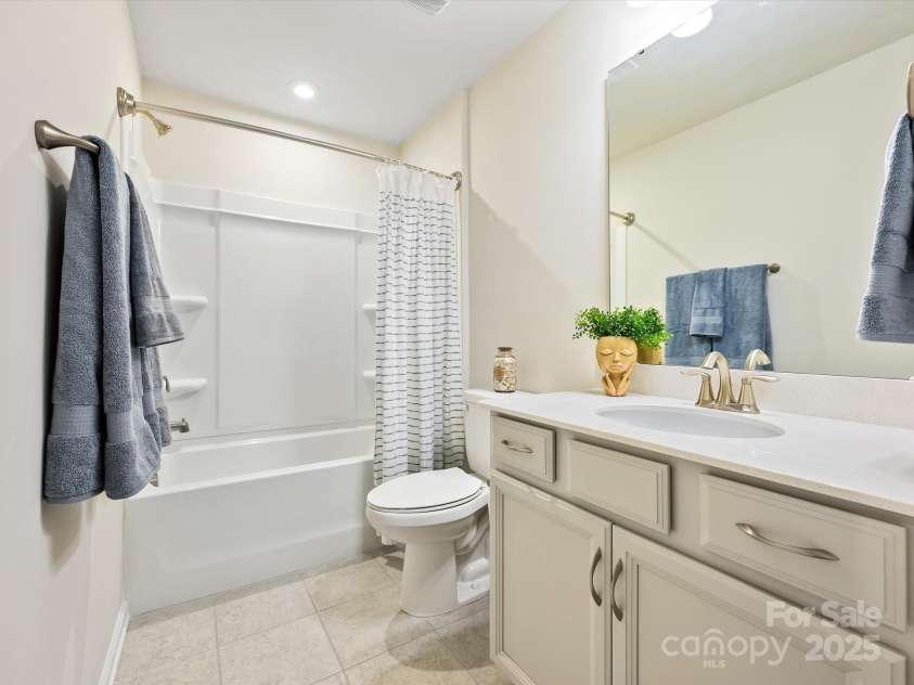 3813 Amalia Place, Indian Land, SC 29707.  MLS# CAR4246224, YatesRealty ID 12822. Bathroom #3 located off the Loft area & just outside of Bedroom #3 features a tub/shower, tile flooring & a linen closet.