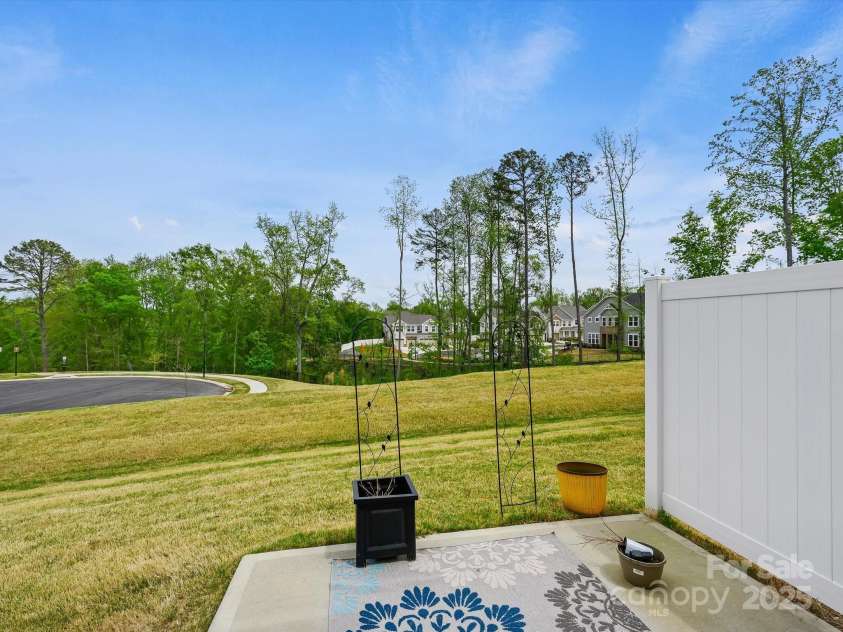 3813 Amalia Place, Indian Land, SC 29707.  MLS# CAR4246224, YatesRealty ID 12822. Semi Private views from the Back Yard Patio Area with Privacy Panels between neighbors.