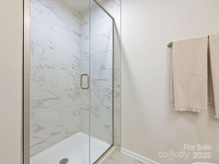 3813 Amalia Place, Indian Land, SC 29707.  MLS# CAR4246224, YatesRealty ID 12822. The Walk in Shower in the Second Story Primary Bathroom.